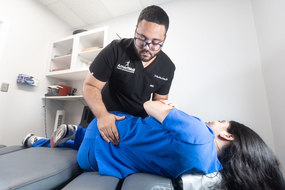 patient with back pain at doctor exam